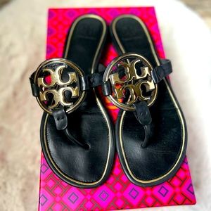 Black and Gold Tory Burch sandals.